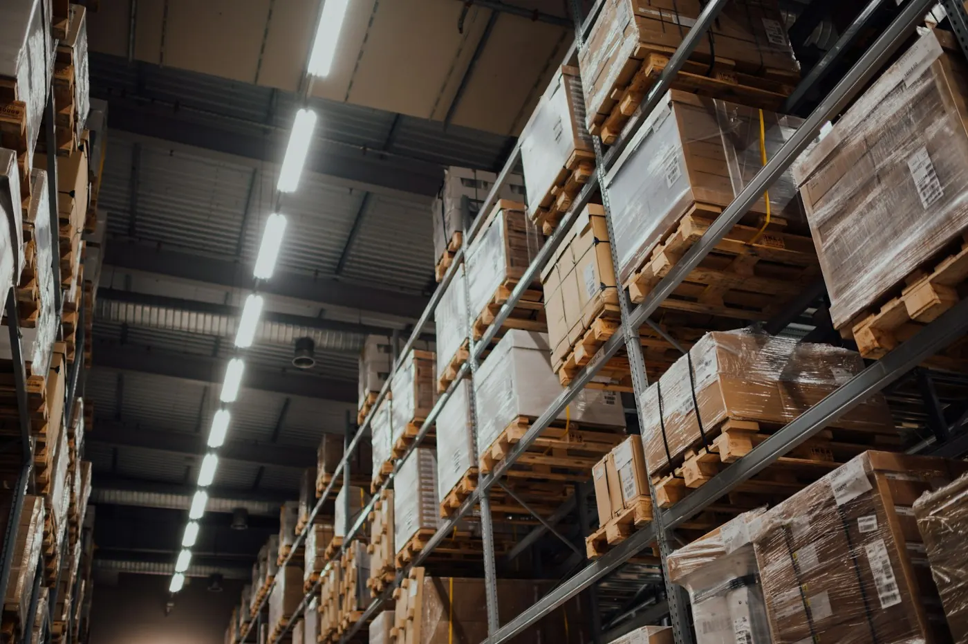 Warehouse aisle stacked with boxed inventory